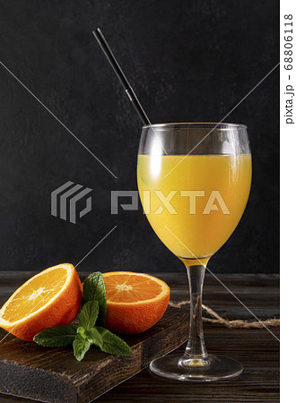 glass of orange juice with mint, fresh half glass of orange juice with mint, fresh half 68806118