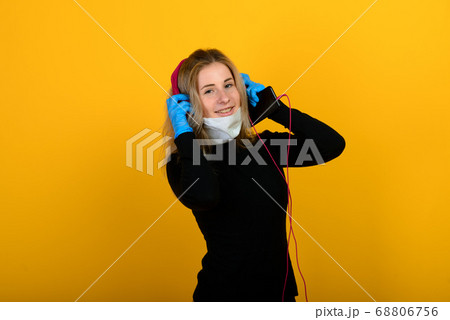 Portrait of a girl in a medical mask, which puts 68806756