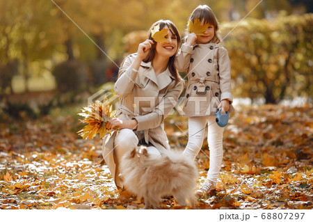 Cute and stylish family in a autumn park 68807297