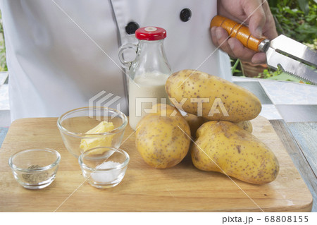 Chef and Ingredients to make mashed Potatoes 68808155