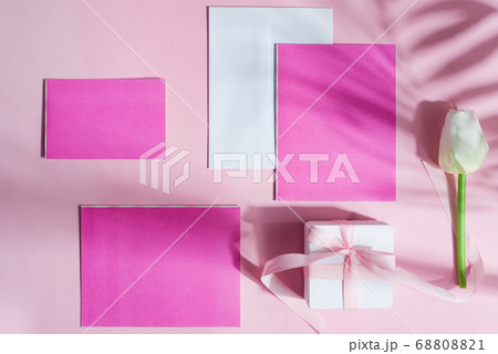 Greeting card with flower, gift box and colored paper. Greeting card with flower, gift box and colored paper. 68808821