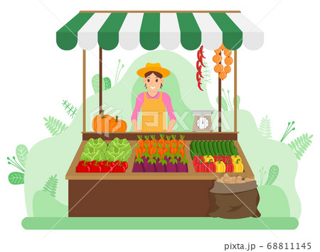 A woman sells vegetables in a vegetable shop at the market. Street trading. Farming and gardening 68811145