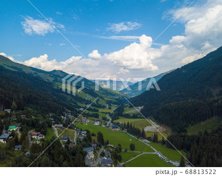 Aerial view from the valley head of the Hinterglemm Mountains to Hinterglemm and Saalbach on a summer day in the Alps at Saalbach-Hinterglemm, Austria 68813522