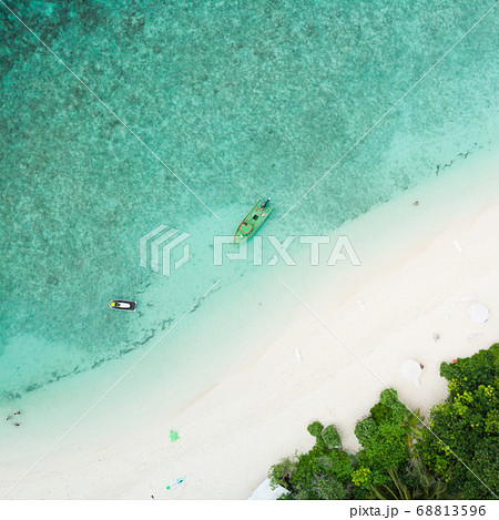 Aerial drone view of picture perfect beach and turquoise lagoon on small tropical island on Maldives 68813596