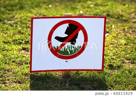 public sign to ban walking on green grass public sign to ban walking on green grass 68815829