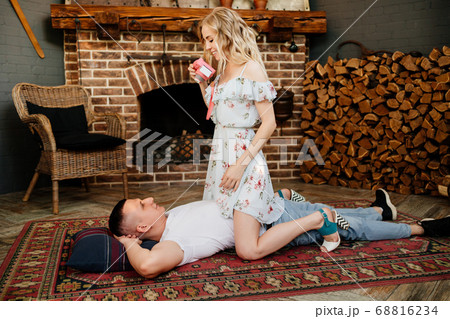 lovers lie in front of fireplace, make photos lovers lie in front of fireplace, make photos 68816234