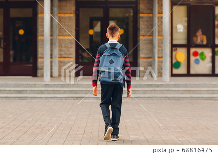 Young boy with backpack going back to school Young boy with backpack going back to school 68816475