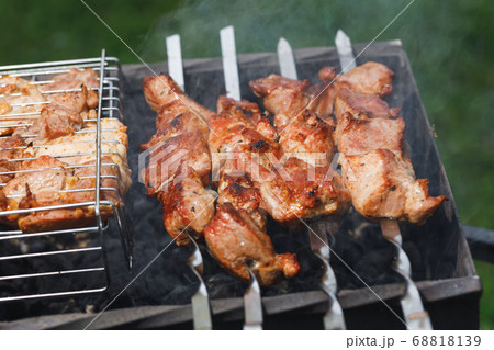 grill barbecue meat on a brazier with smoke, green grill barbecue meat on a brazier with smoke, green 68818139