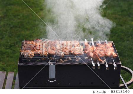 grill barbecue meat on a brazier with smoke, green grill barbecue meat on a brazier with smoke, green 68818140