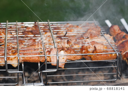 grill barbecue meat on a brazier with smoke, green grill barbecue meat on a brazier with smoke, green 68818141