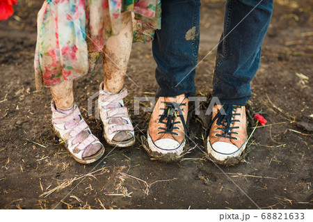 dirty shoes. goes in road after rain. dirty shoes. goes in road after rain. 68821633