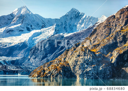 Alaska nature travel. Glacier Bay National Park, Alaska, USA. Glaciers landscape of alaska mountain peaks and glacier melting in water. View from cruise ship. 68834680