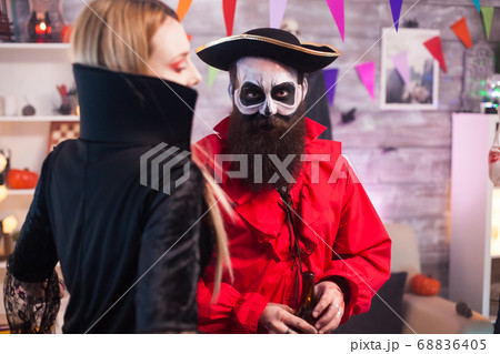 Man dressed up like a pirate with creative makeup Man dressed up like a pirate with creative makeup 68836405