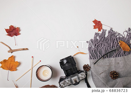 Scarf, camera, candle and yellow leaves, top view Scarf, camera, candle and yellow leaves, top view 68836723