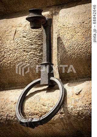 Old wrought iron ring to tie the horses - Florence Tuscany Italy Old wrought iron ring to tie the horses - Florence Tuscany Italy 68842646