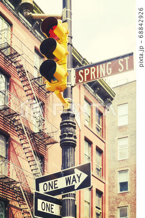 New York City street signs and traffic lights at Spring Street. 68842926