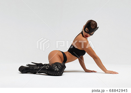 Sensual woman in black mask and underwear Sensual woman in black mask and underwear 68842945