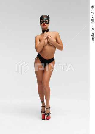 Sexy topless woman in black mask Sexy topless woman in black mask 68842946