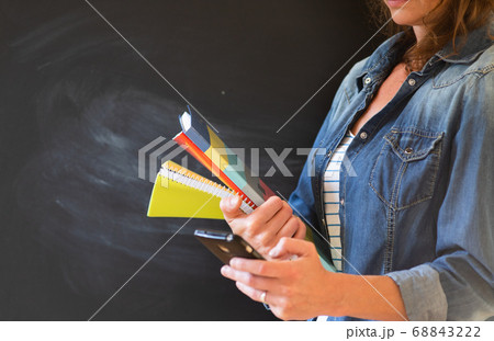 student with books and smartphone 68843222