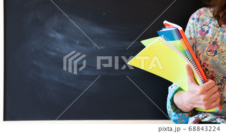 student with books and smartphone 68843224