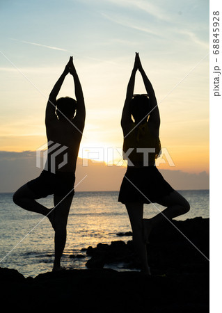 Sunset, sea, yoga, people Sunset, sea, yoga, people 68845928