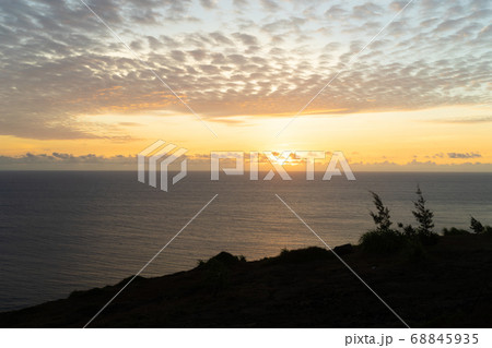 The sun rising on the sea 68845935