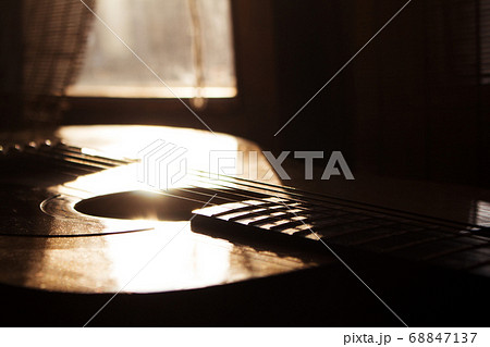 Acoustic Guitar In Music Studio Close up. Shined By The Sun Acoustic Guitar In Music Studio Close up. Shined By The Sun 68847137