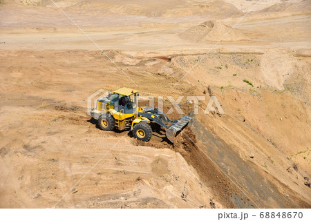 Front end loader has been recovering the landscape around the open pit 68848670