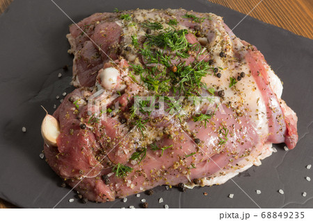 raw turkey meat, some thigh stuffed with garlic 68849235
