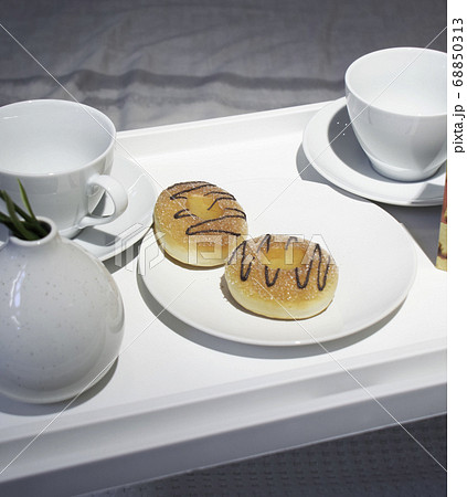 Breakfast in bed. Donuts for breakfast. Breakfast in bed at weekend 68850313