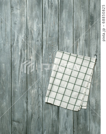 Gray wooden table with kitchen napkin, flat lay 68850825