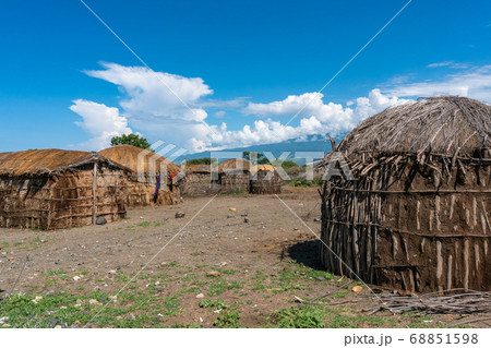 Traditional Maasai Village with Clay Round Huts in Engare Sero area near Lake Natron and Ol Doinyo Lengai volcano in Tanzania, Africa 68851598