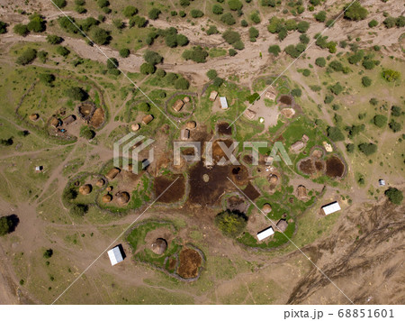 Aerial view of Maasai boma or family rural village on the coast of Salty lake Natron in the Great Rift Valley, Tanzania Aerial view of Maasai boma or family rural village on the coast of Salty lake Natron in the Great Rift Valley, Tanzania 68851601