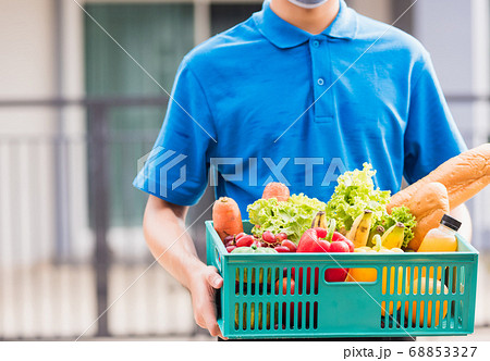 Delivery man wearing face mask protect he Delivery man wearing face mask protect he 68853327