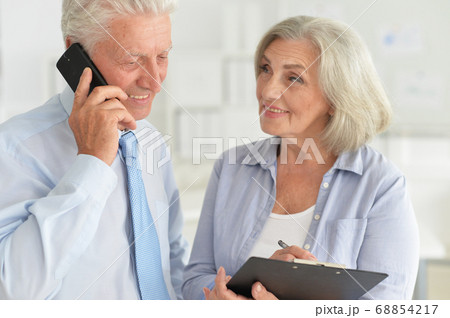 Successful senior businesspeople working together in modern office 68854217