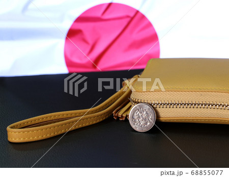 Japanese one hundred Yen coins on obverse (Sakura blossoms) with sand color wallet 68855077