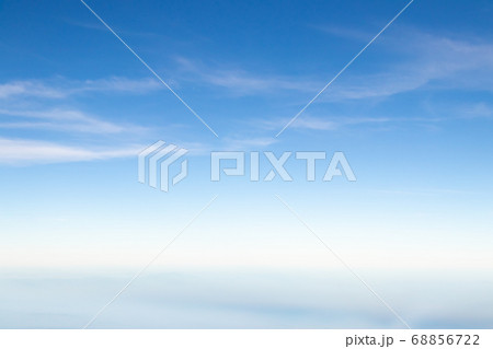 Clear blue sky with white cloud background 68856722