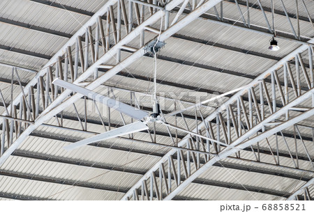 Large ceiling fan on the metal frame. 68858521