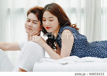 Happy couple in bed 68859323