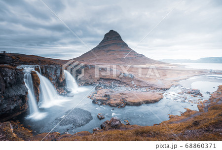 Kirkjufellsfoss Waterfall and Kirkjufell mountain Kirkjufellsfoss Waterfall and Kirkjufell mountain 68860371
