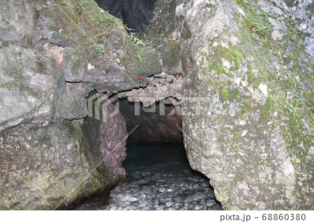 natural view with underground river between the rocks 68860380