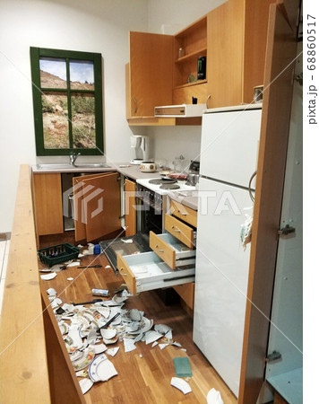 A mess in the kitchen, broken dishes, open A mess in the kitchen, broken dishes, open 68860517