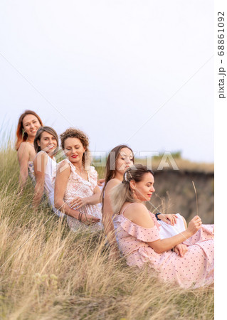 A cheerful company of beautiful girls friends 68861092