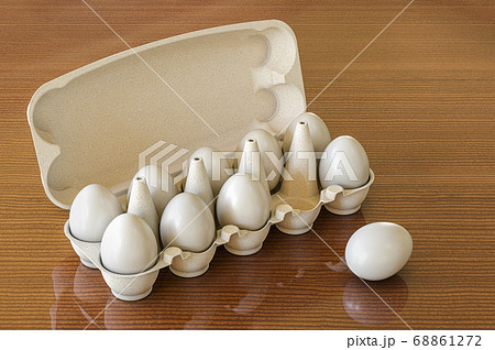 Eggs in an egg carton on wooden desk, 3D rendering 68861272