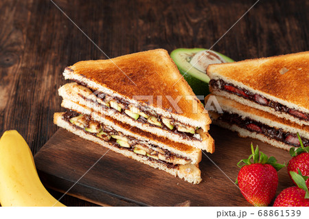 Sandwich toast with chocolate paste and cut strawberry Sandwich toast with chocolate paste and cut strawberry 68861539