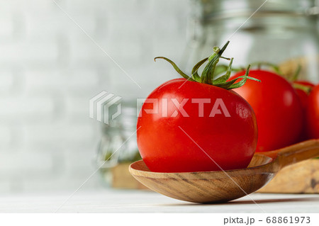 Close up of cherry tomatoes on kitchen table Close up of cherry tomatoes on kitchen table 68861973