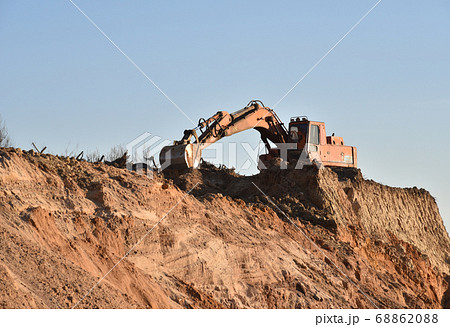Large excavator working at construction site. 68862088