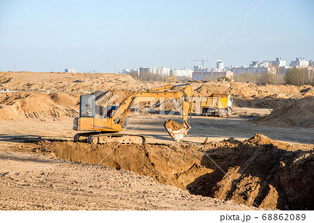 Large excavator working at construction site. 68862089