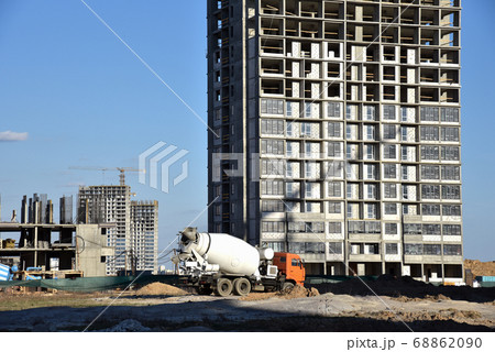 Heavy mixer concrete truck waiting for to be loaded concrete at a construction site 68862090