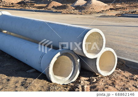 Concrete drainage pipes at the construction site. Concrete drainage pipes at the construction site. 68862146